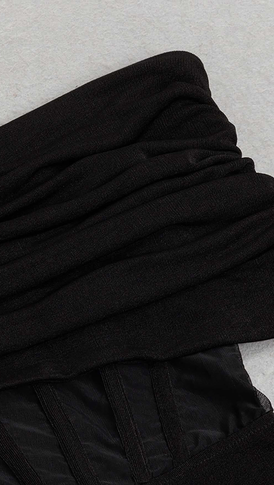 OFF SHOULDER MESH JUMPSUIT IN BLACK