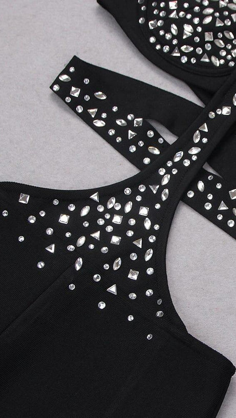 Ärmelloser Jumpsuit mit Pailletten und Cut-Outs in Schwarz