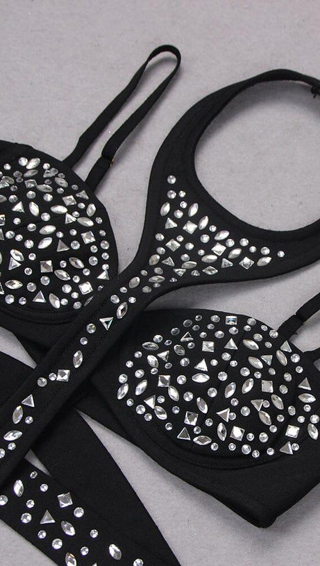 Ärmelloser Jumpsuit mit Pailletten und Cut-Outs in Schwarz