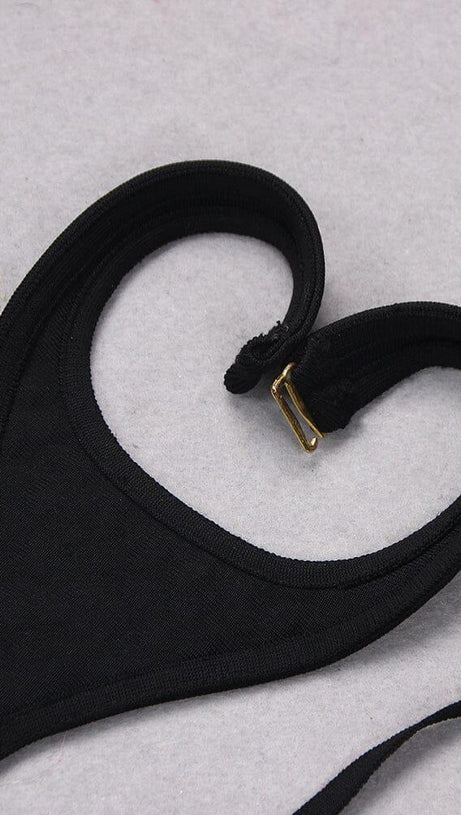 Ärmelloser Jumpsuit mit Pailletten und Cut-Outs in Schwarz