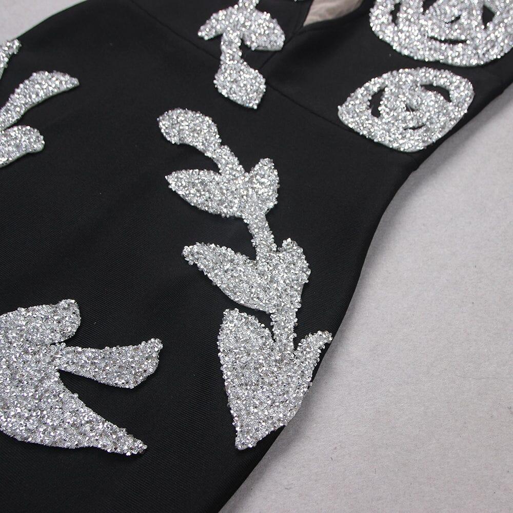 ABITO MIDI CON CORSETTO E PAILLETTES IN NERO