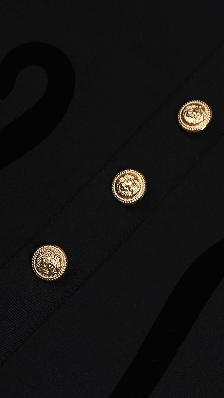 SCULPTURE BUTTON MINI DRESS IN BLACK