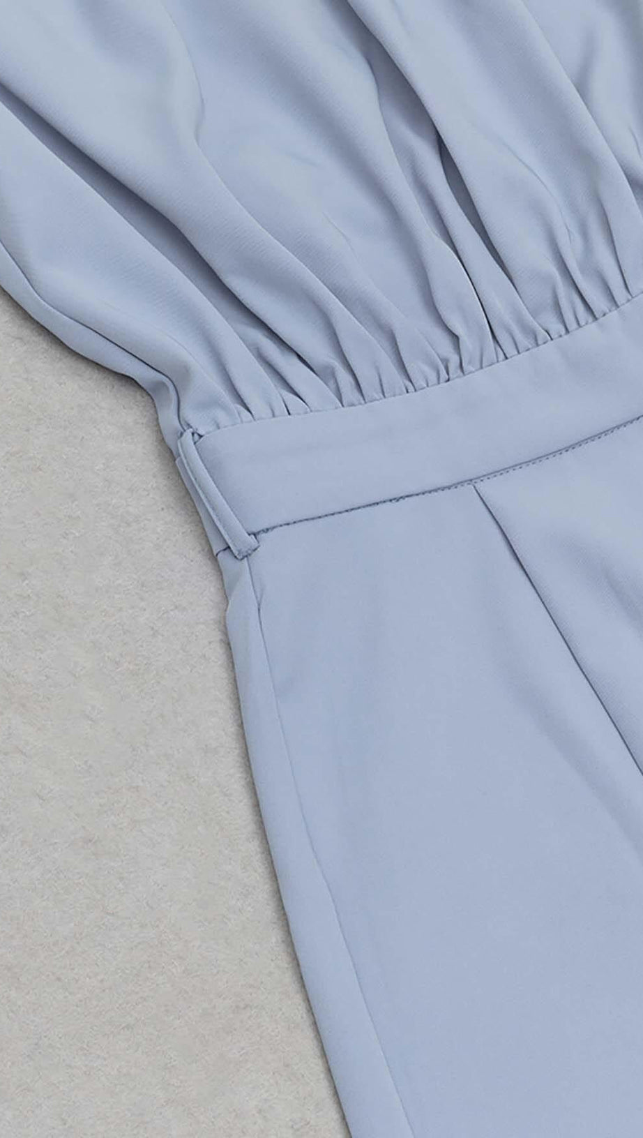 MOCK-NECK BELTED JUMPSUIT IN BLUE