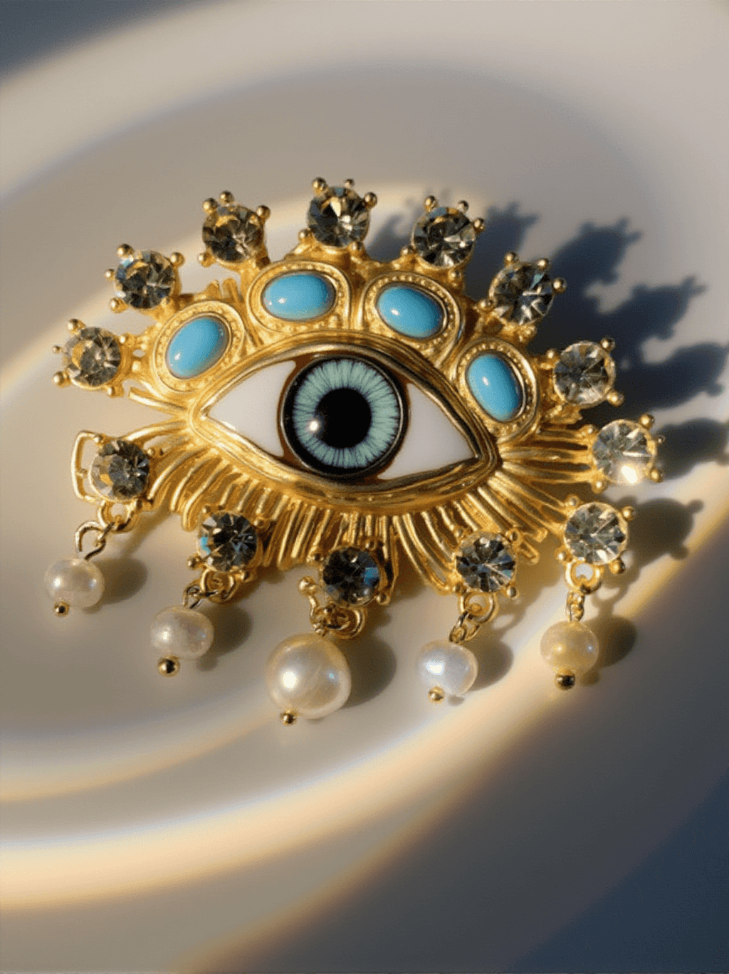 HEMLOCK PEARL EMBELLIHSED EYE BROOCH
