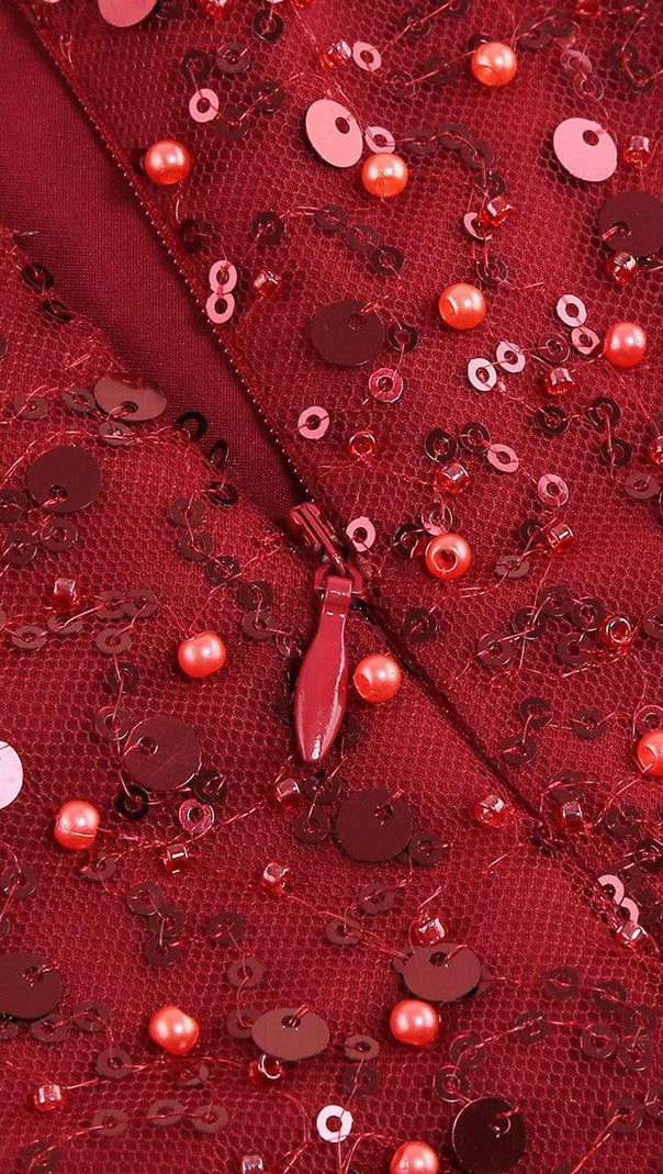 ABITO CON PIUME ROSSE E PAILLETTES