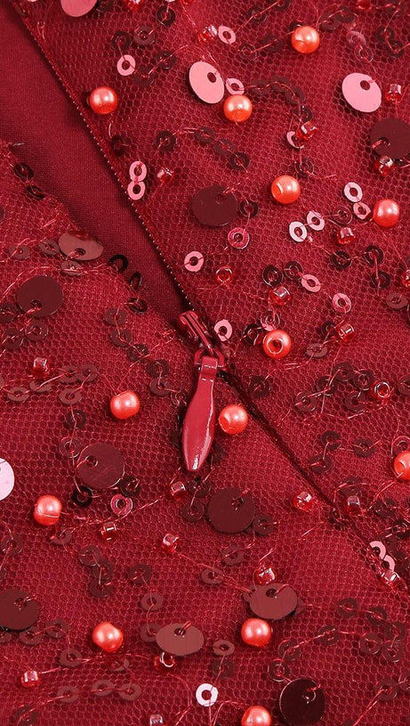 ABITO CON PIUME ROSSE E PAILLETTES