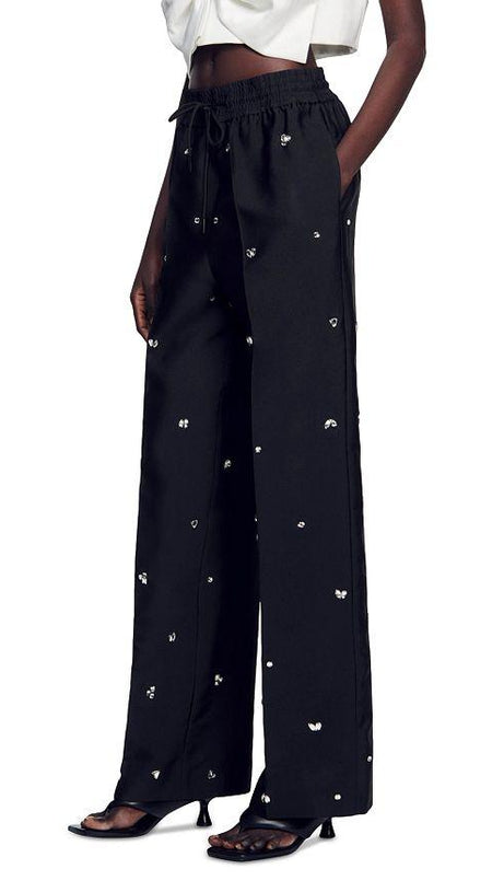 PANTALONI OVERSIZE IN TAFFETÀ DECORATI 