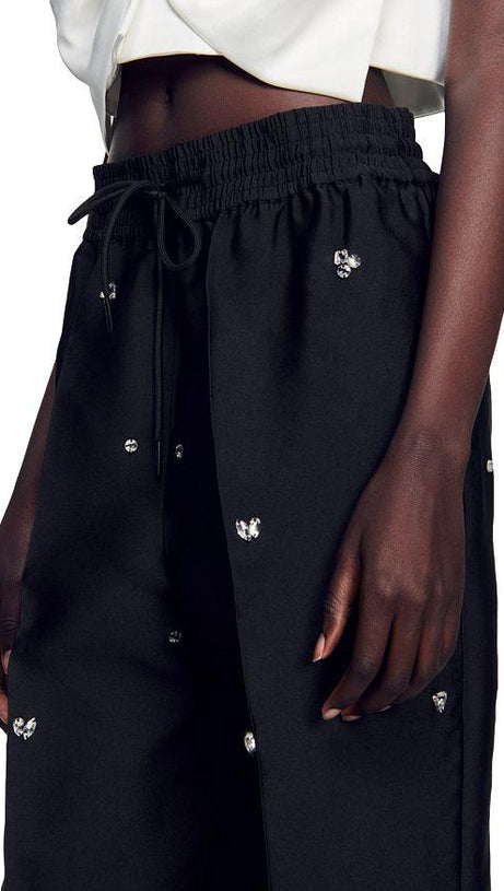 PANTALONI OVERSIZE IN TAFFETÀ DECORATI 