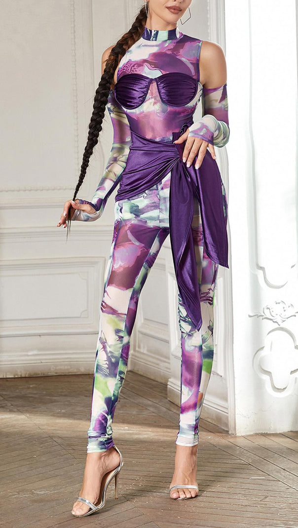 TUTA SKINNY CON PANNELLI STAMPATI E CINGHIE 