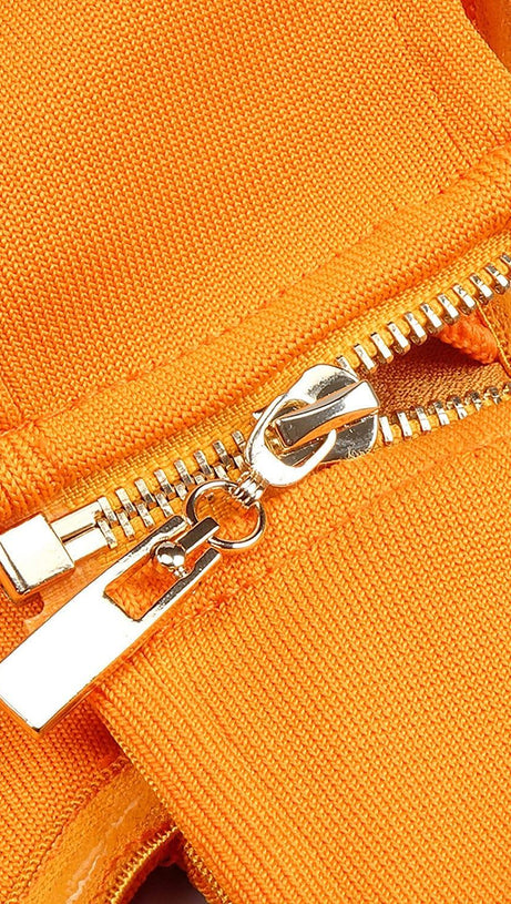 BUSTIER NECKLINE CUT OUT BANDAGE DRESS IN ORANGE