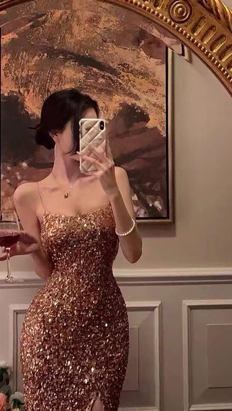 ABITO MIDI CON SPACCHI E PAILLETTES IN ORO