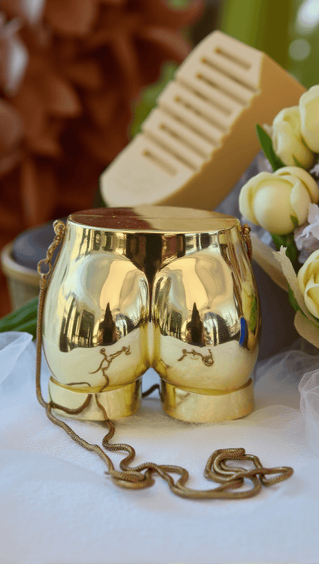 MORWENNA ACRYLIC BUTT BAG IN GOLD