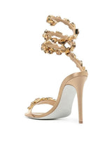 Elyra Snake Rhinestone Sandals In Gold