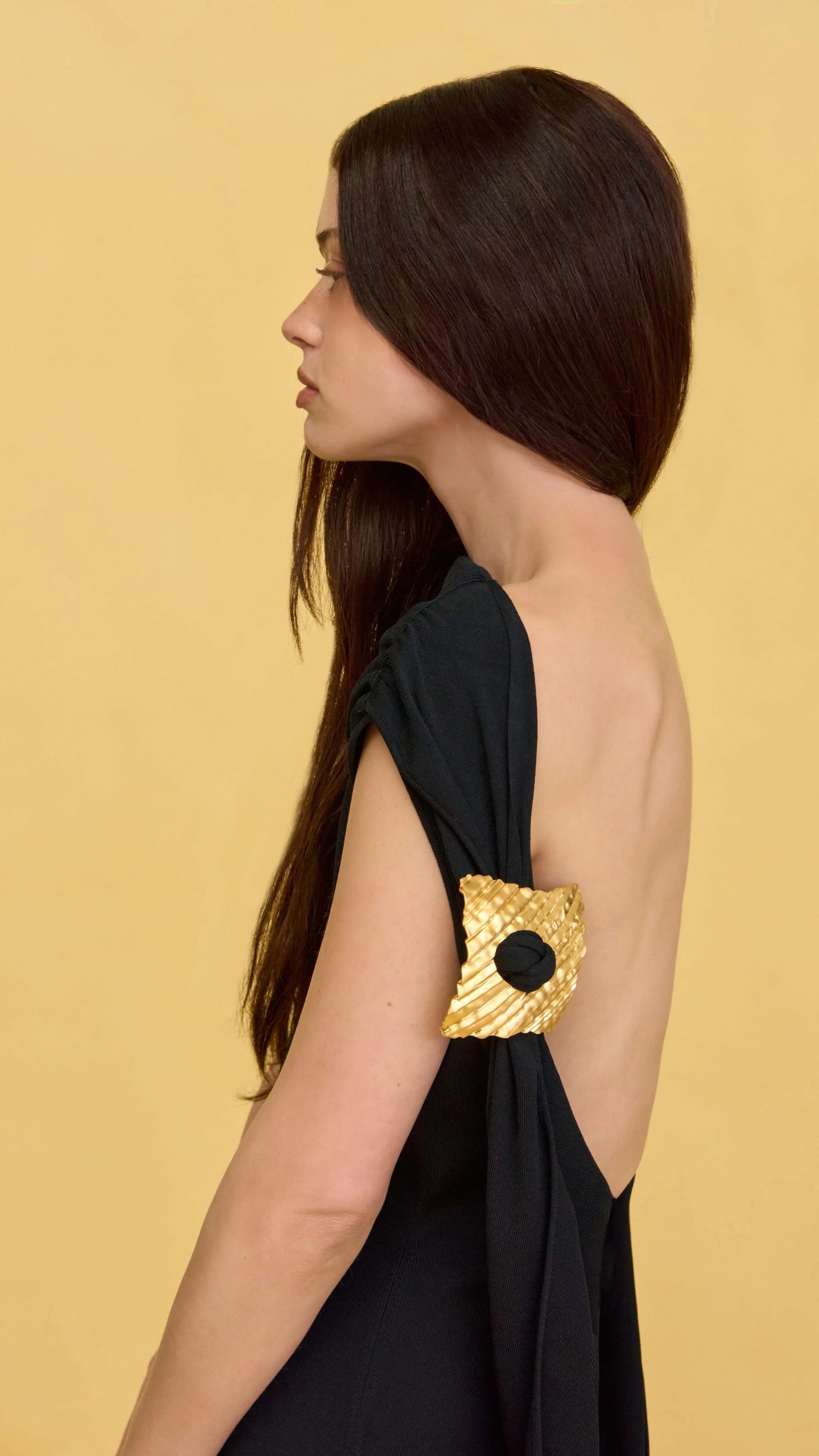 AIIZIE BLACK SLEEVELESS BACKLESS KNIT MIDI DRESS WITH TWO PLEATED GOLDEN EMBELLISHMENTS - product image