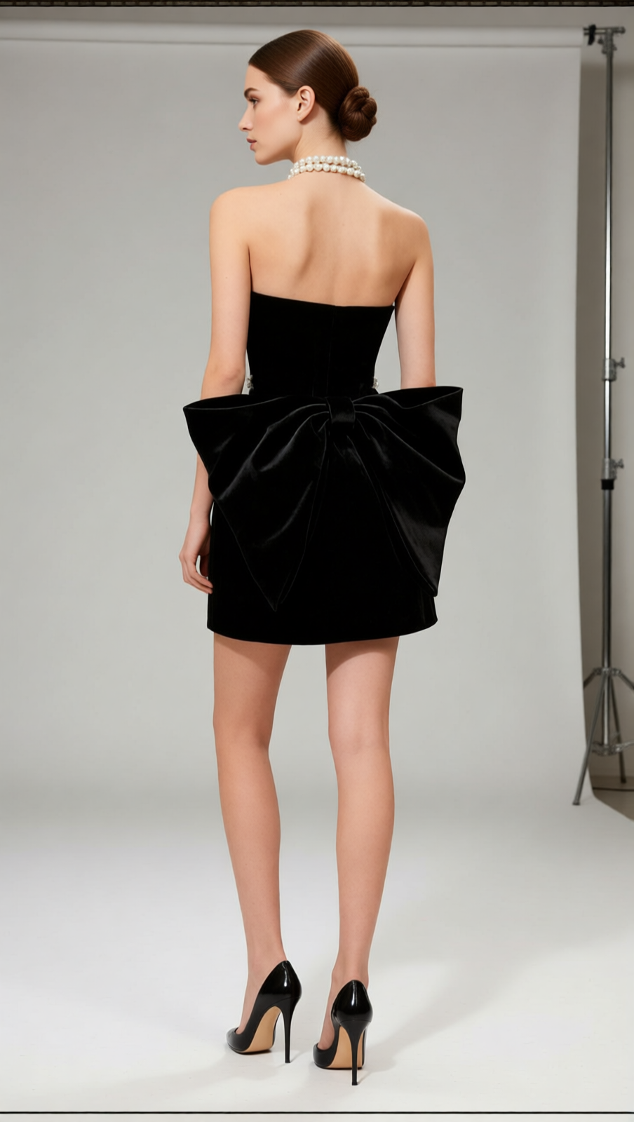 Jens Glamorous Black Velvet Strapless Mini Dress | Rhinestone Illusion & Statement Bow